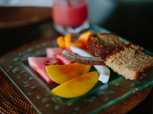 A tropical fruit platter served with home-made bread on the side