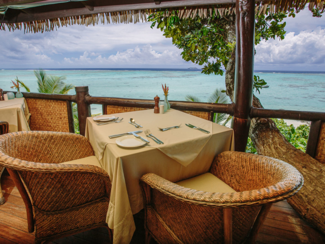Dining table set up for two in the Rapae Restaurant overlooking the lagoon