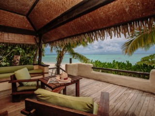 A breath-taking view of the Premium Beachfront Bungalow private balcony overlooking the lagoon