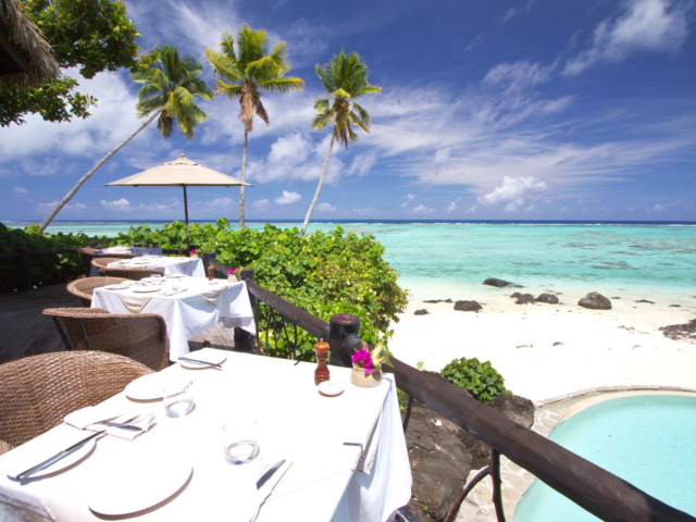 A beautiful and simple table setting on Rapae Restaurant Balcony overlooking the lagoon, on a clear bright day