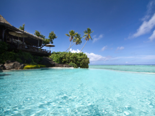 A partial image of the Rapae Restaurant with a stunning view of the pool adjoining the lagoon