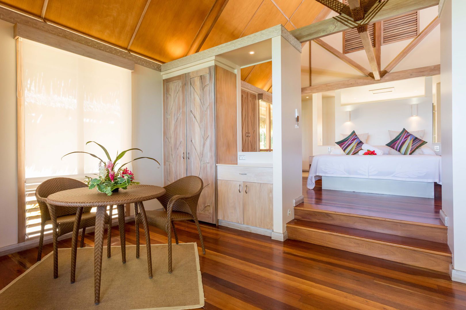 Modern & Elegant Polynesian inspired beachfront bungalow bedroom and living area