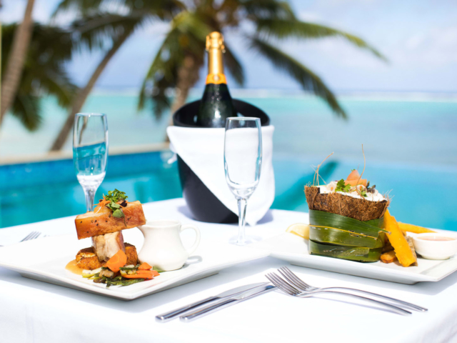 Romantic restaurant meals by the pool overlooking the lagoon