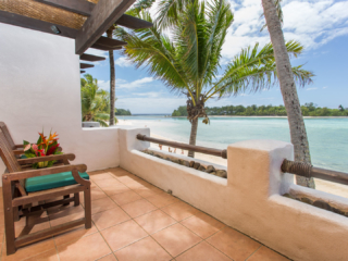 A stunning image of the Premium Beachfront Suite balcony overlooking the beautiful Muri Lagoon