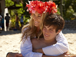 Focal asset of a family-friendly resort featuring mother and son enjoying the beach under the sun