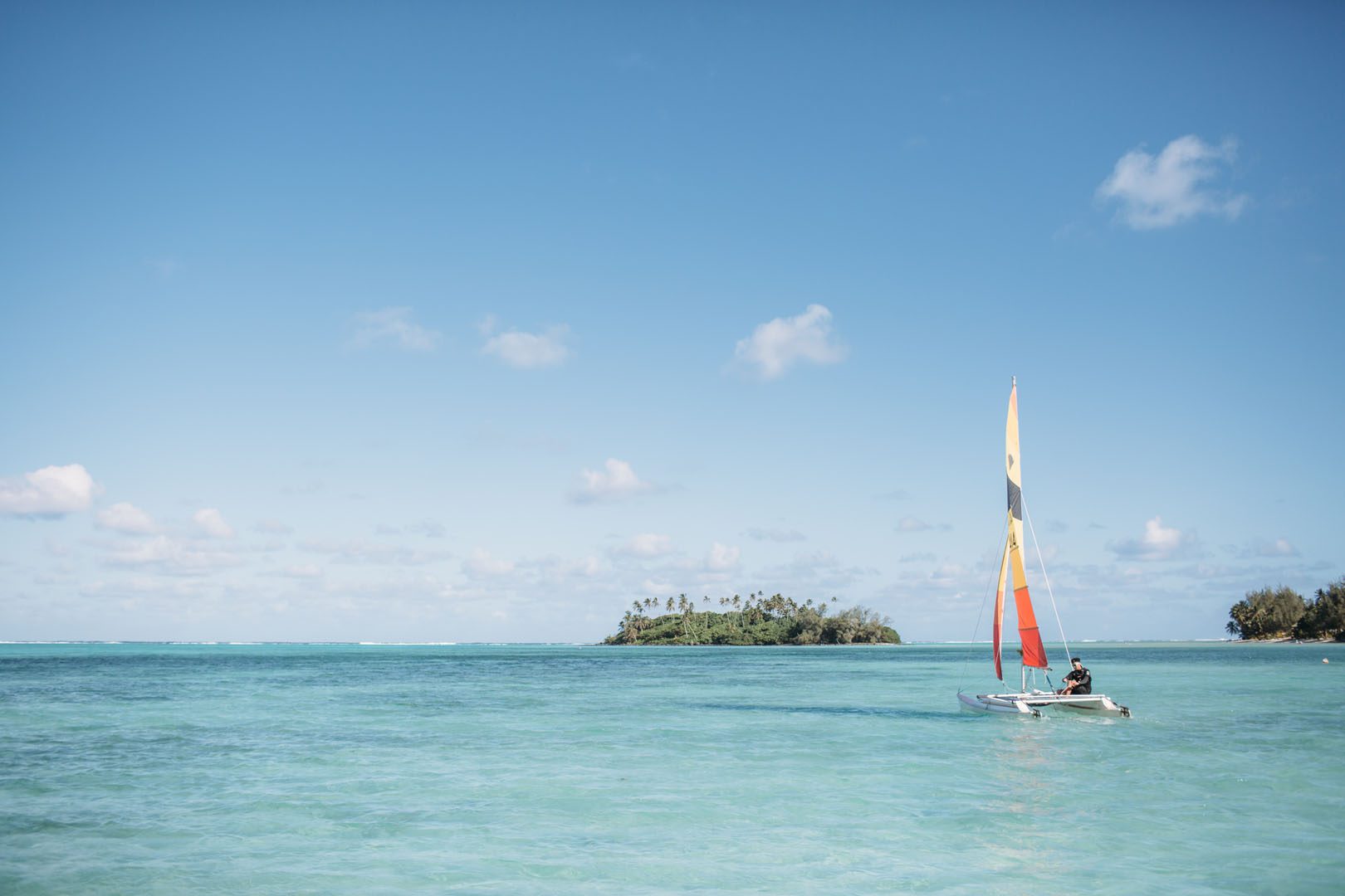 A resort guest exploring the Muri lagoon on a Sail Boat