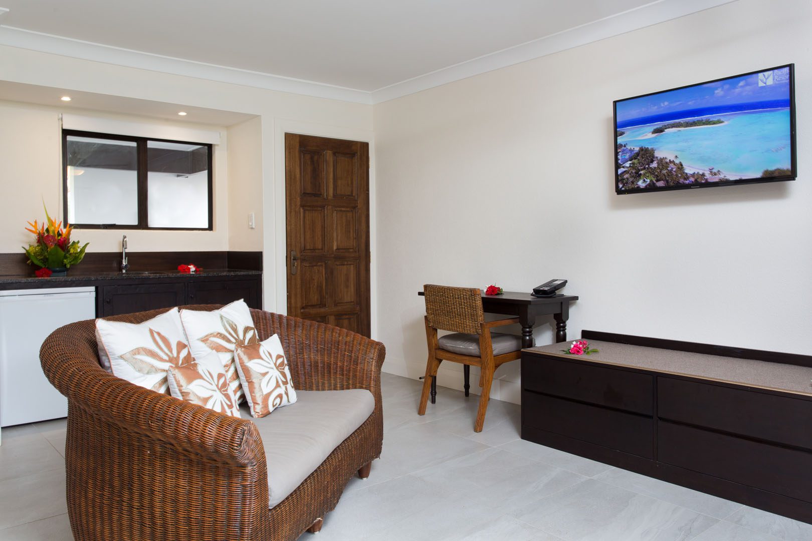 Image of a newly refurbished Standard Studio lounge area featuring a flat TV screen and the in-room attributes