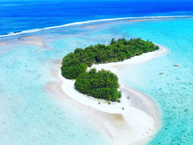 A breath-taking aerial view of Motu Koromiri, a secluded island, beautifully set amidst the Muri Lagoon