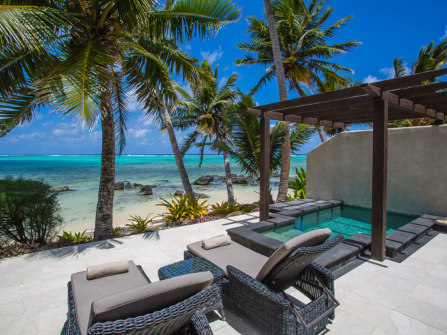 Beachfront Villa Suite view of the stunning outdoor private pool & tiled patio area overlooking the lagoon