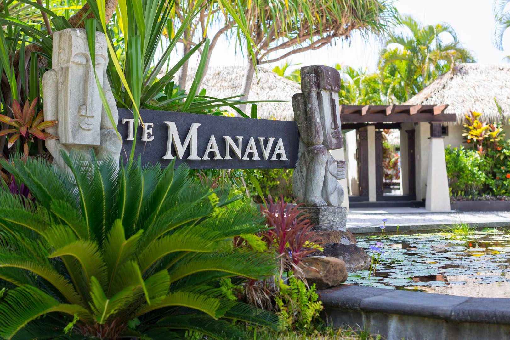 View of the te manava entrance surrounded by beautiful tropical gardens and pond