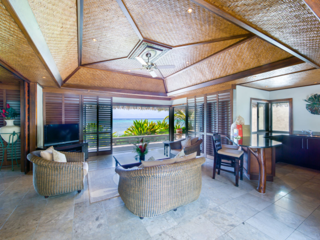 Te Manava Luxury Villas & spa Ultimate beachfront villa view from the inside the lounge & modern kitchen with a Polynesian décor