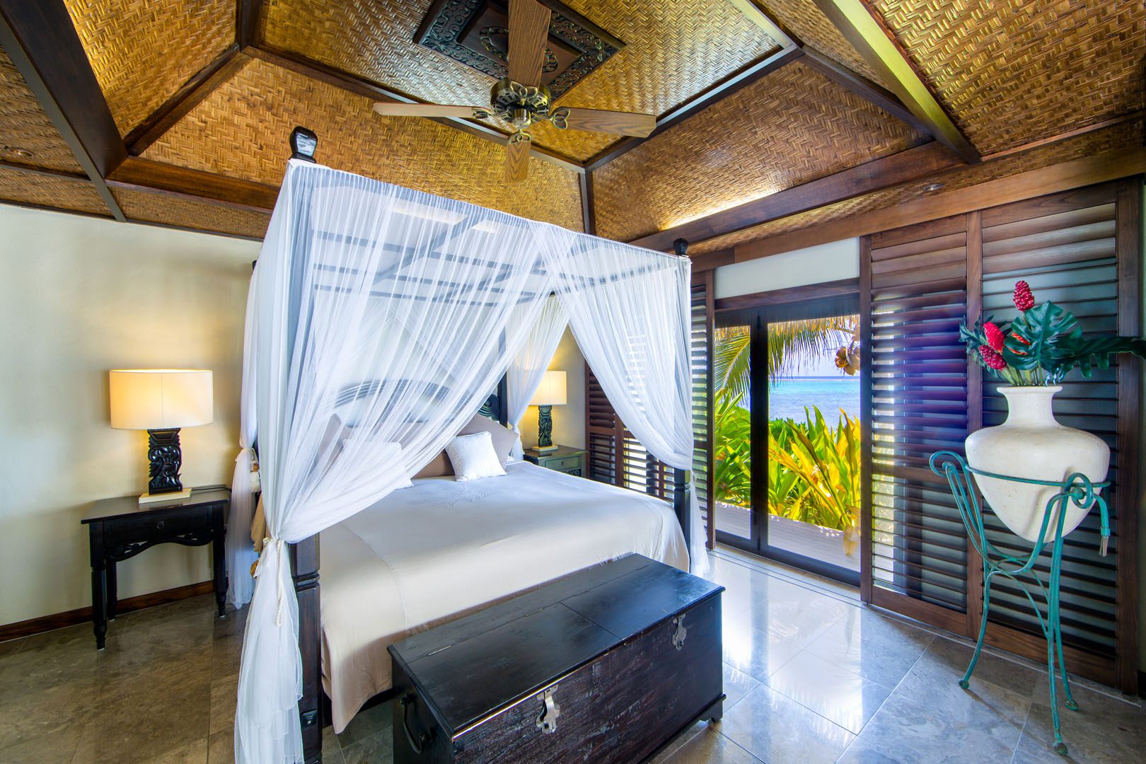 Te Manava Luxury Villas & Spa & Ultimate beachfront villa bedroom view from inside the master bedroom overlooking the water and gardens
