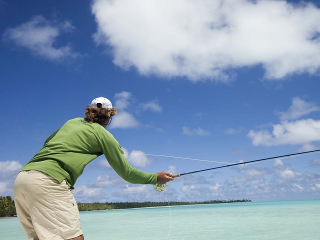 Gentleman Bonefishing in the clear blue lagoon in Aitutaki