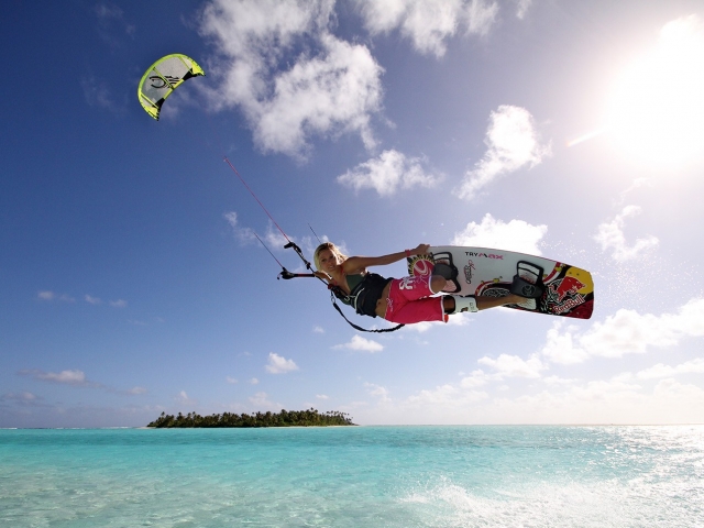 kiteboarding along Aitutaki's beautiful lagoon