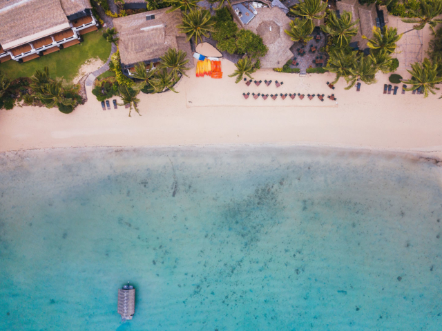 Aerial image of the Resort Beachfront featuring the long stretched-white-sandy beach along the Muri lagoon