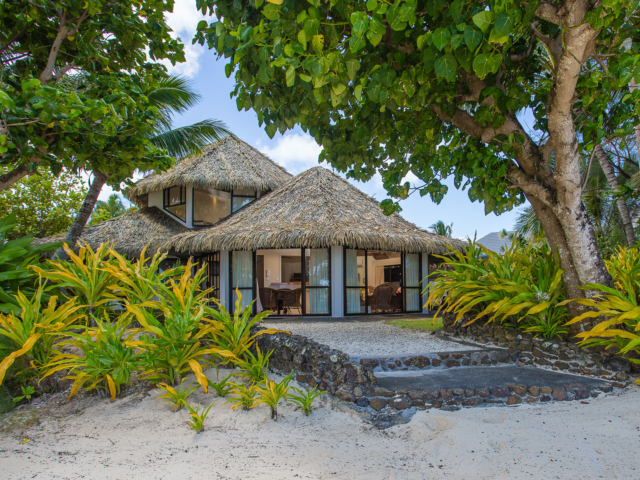 Premium Beachfront Villa view from the beach featuring the beautiful arranged pebbles pathway from the villa entrance to the beach