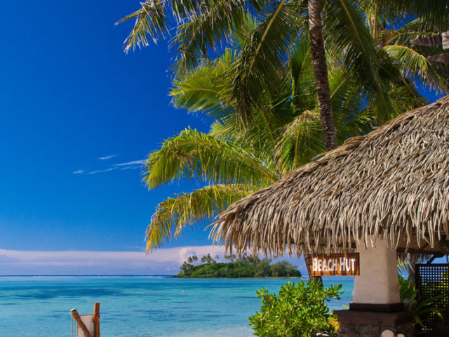 Image of the Resort Beach hut conveniently located on the beach, showcasing the bean bags lined up on the beach and a Kids Club daily program printed on a foot-shaped black board