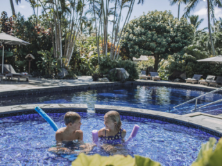 Children enjoying their splash pool set aside from the adults swimming pool