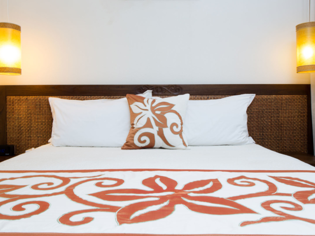 Image of Polynesian Flare between the king size bed to enhance lighting in the room