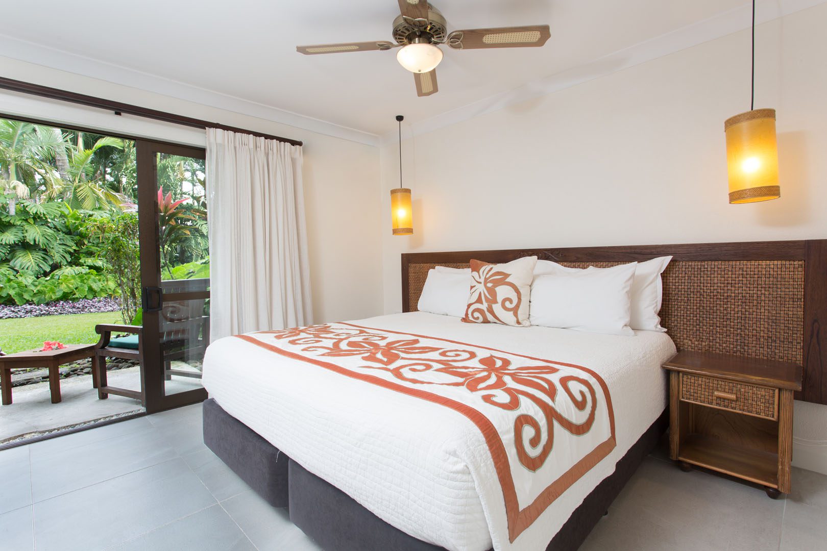 Image of the Super King-sized bed in the Standard Family Room showcasing a beautiful garden view outside the balcony