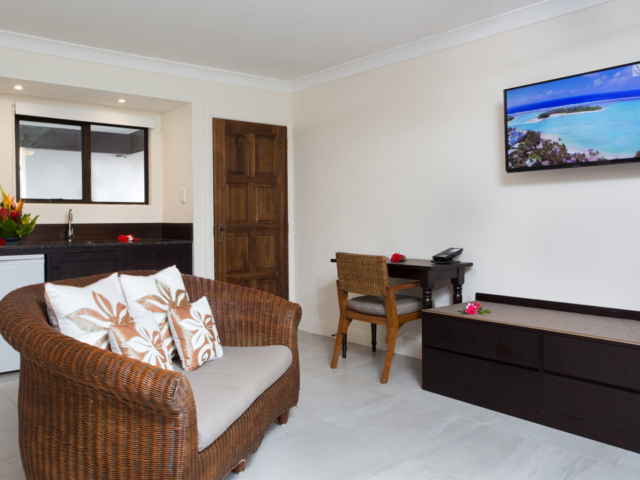 Image of a newly refurbished Standard Studio lounge area featuring a flat TV screen and the in-room attributes