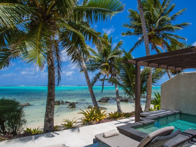 Beachfront Villa Suite view of the stunning outdoor private pool & tiled patio area overlooking the lagoon