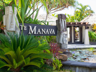 View of the te manava entrance surrounded by beautiful tropical gardens and pond