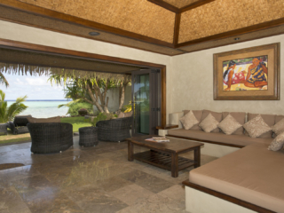 View of the Ultimate Beachfront villa lounge area that is beautifully layout and inspired by Polynesian art and décor