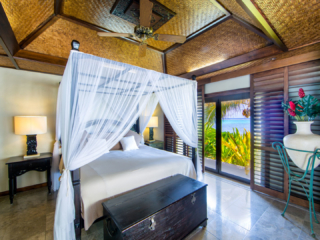 Te Manava Luxury Villas & Spa & Ultimate beachfront villa bedroom view from inside the master bedroom overlooking the water and gardens