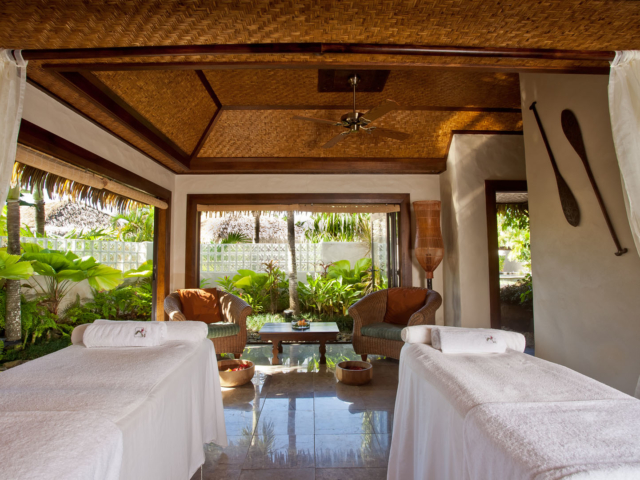 Luxurious spa with Polynesian inspired decor, looking out to the lush tropical gardens