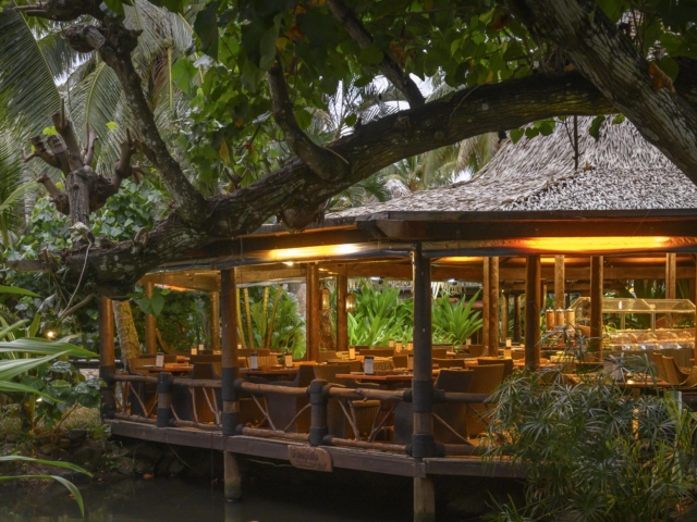 Image of Sandals Restaurant with lighting that illuminates the interior set up and other decorations