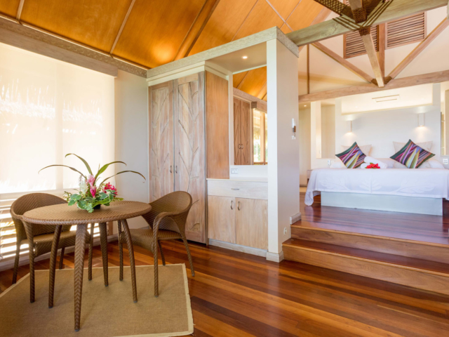 Modern & Elegant Polynesian inspired beachfront bungalow bedroom and living area