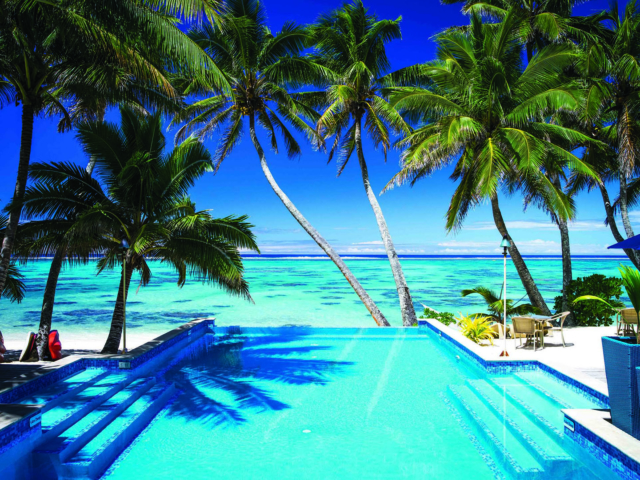 An infinity pool overlooking the lagoon on a sunny day