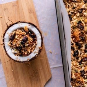 Place baked granola in bowl