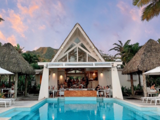 Little Polynesian Resort - Restaurant & Pool During Sunset